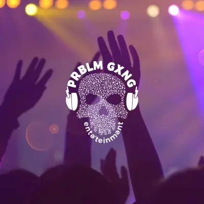 hands in the air of eventgoers in front of a stage with light shining into the crowd
